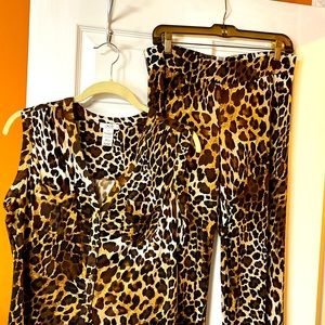 2 pc leopard pant set. Top buttons down ties at waist. Pants elastic waist